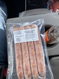 A labeled Buckeye FarmZ package of smoked cheddar bratwurst