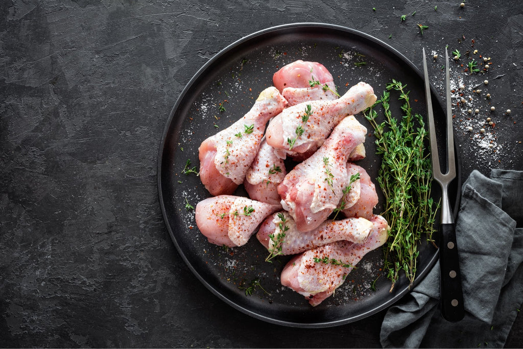 A labeled Buckeye FarmZ LLC package of young chicken drumsticks