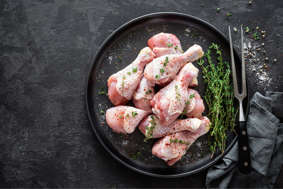 A labeled Buckeye FarmZ LLC package of young chicken drumsticks
