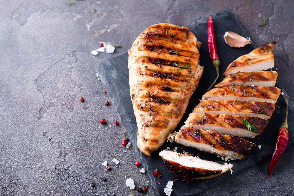 A labeled Buckeye FarmZ LLC package of boneless young chicken breasts