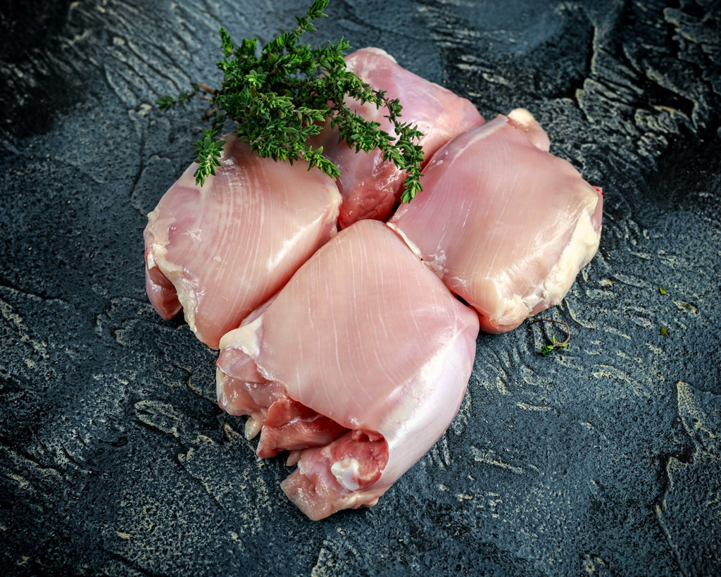 A labeled Buckeye FarmZ LLC package of young chicken thighs
