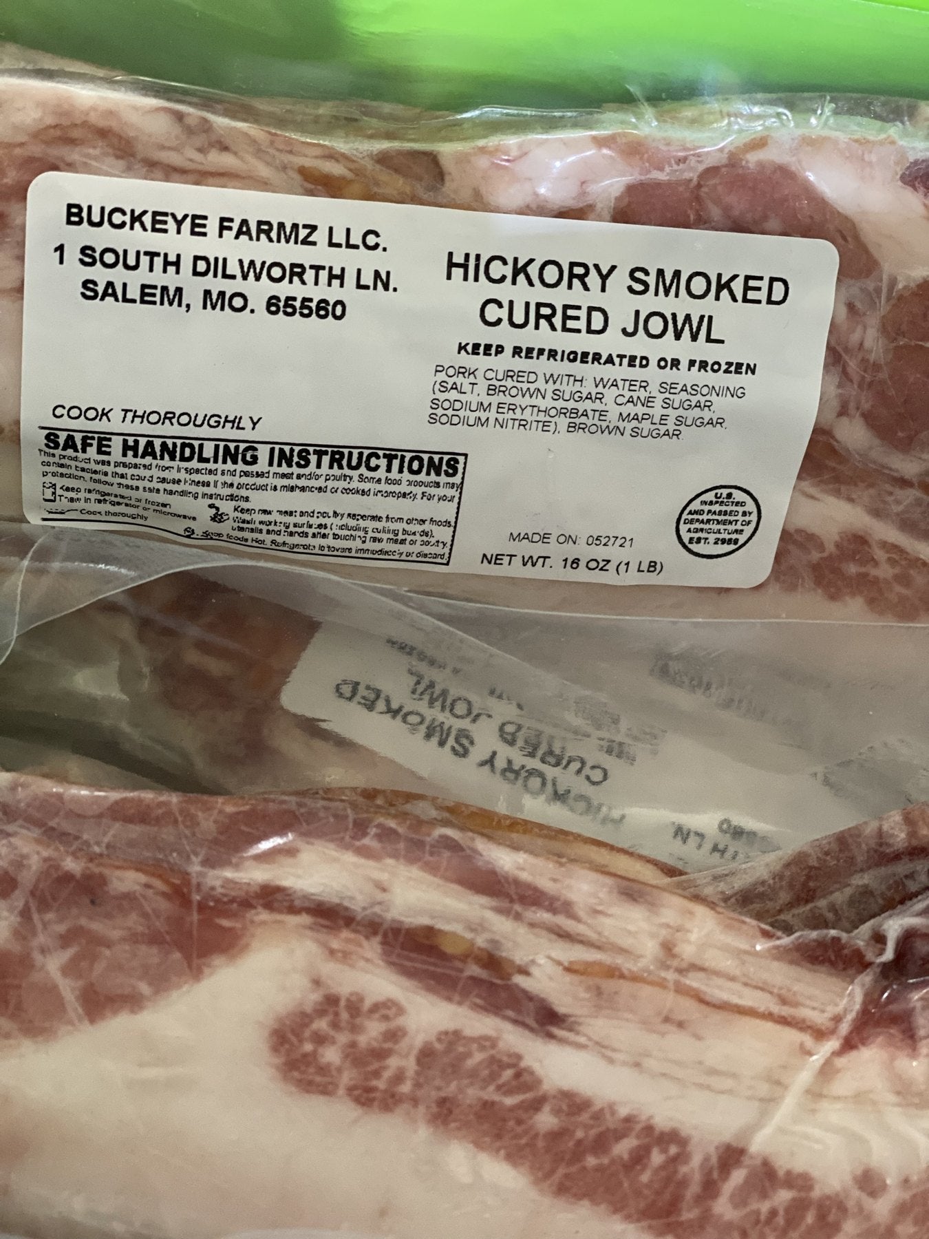 A labeled Buckeye FarmZ package of hickory smoked cured pork jowl