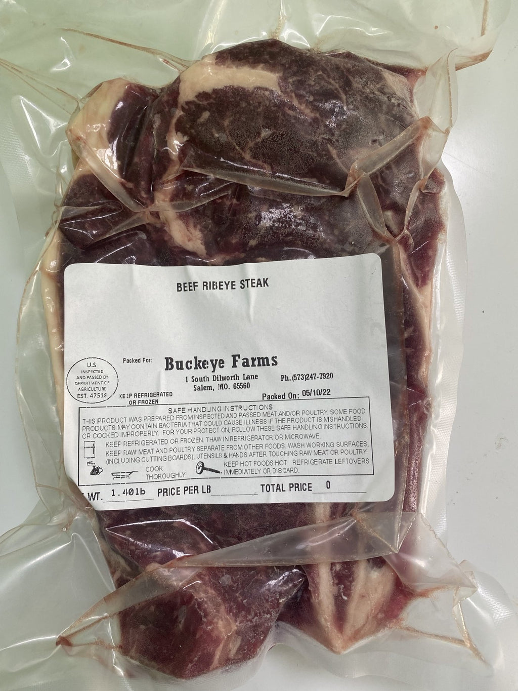 A labeled Buckeye FarmZ package of beef ribeye steak from the family farm