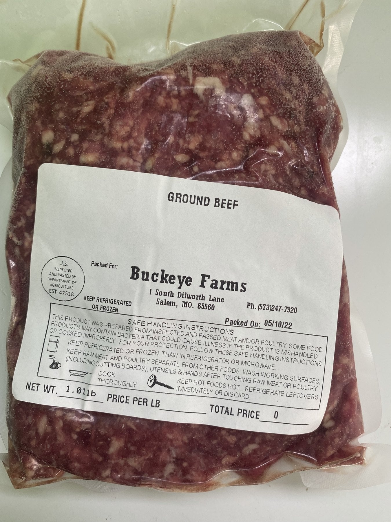 A labeled Buckeye Farms package of ground beef, packed at the farm in Salem, Missouri