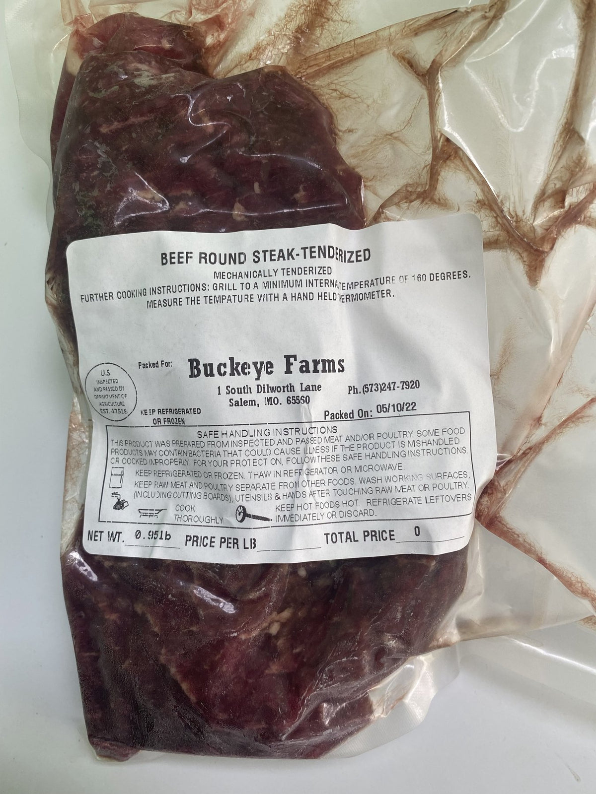 A labeled Buckeye FarmZ package of tenderized beef round steak