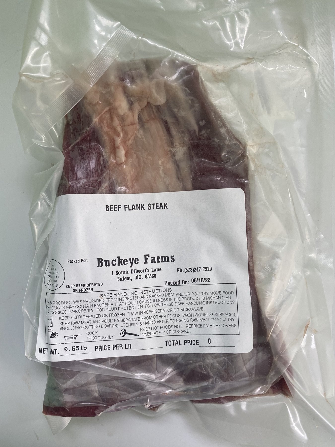A labeled Buckeye Farms package of beef flank steak