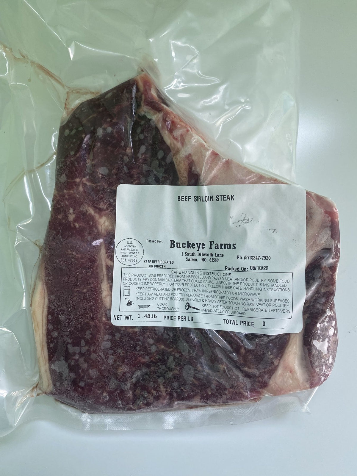 A labeled Buckeye Farms package of beef sirloin steak
