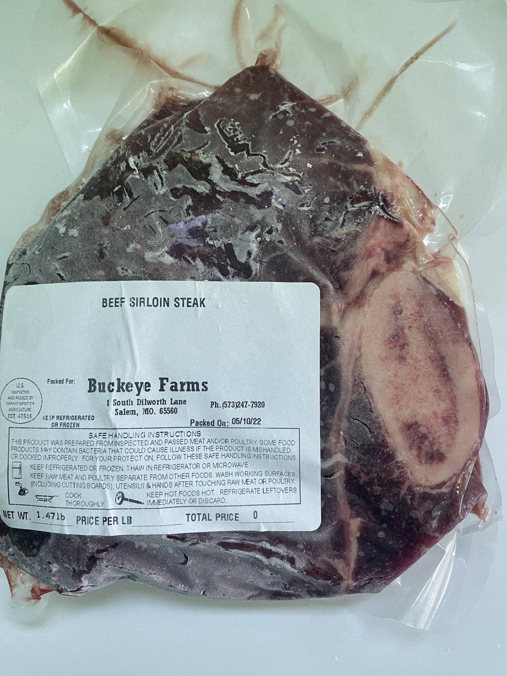 A labeled Buckeye Farms package of beef sirloin steak