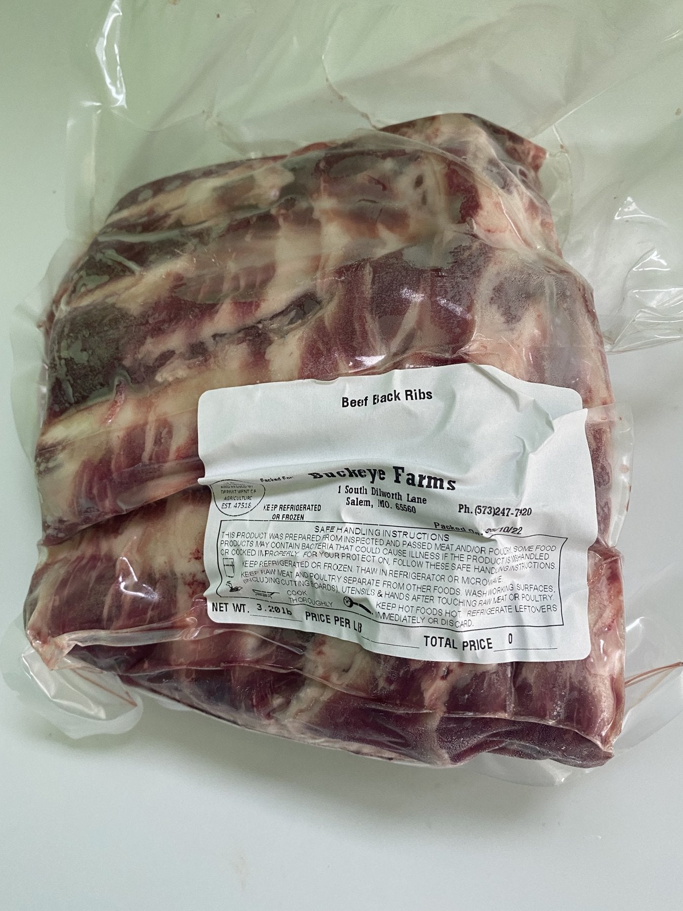 A labeled Buckeye Farms package of ribs