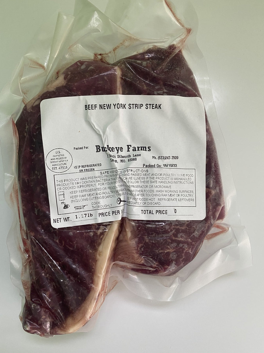 A labeled Buckeye Farms package of beef New York strip steak