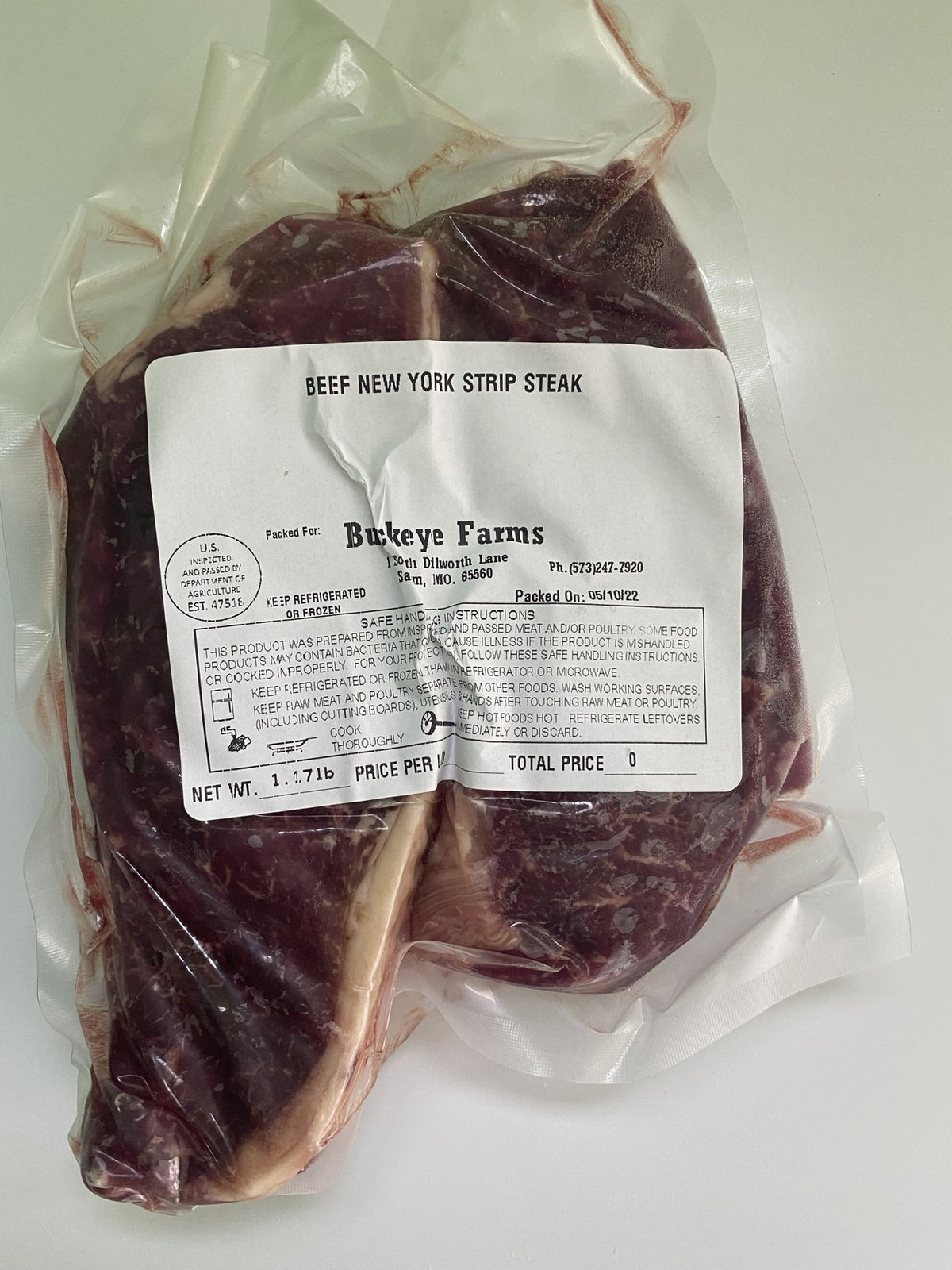 A labeled Buckeye Farms package of beef New York strip steak