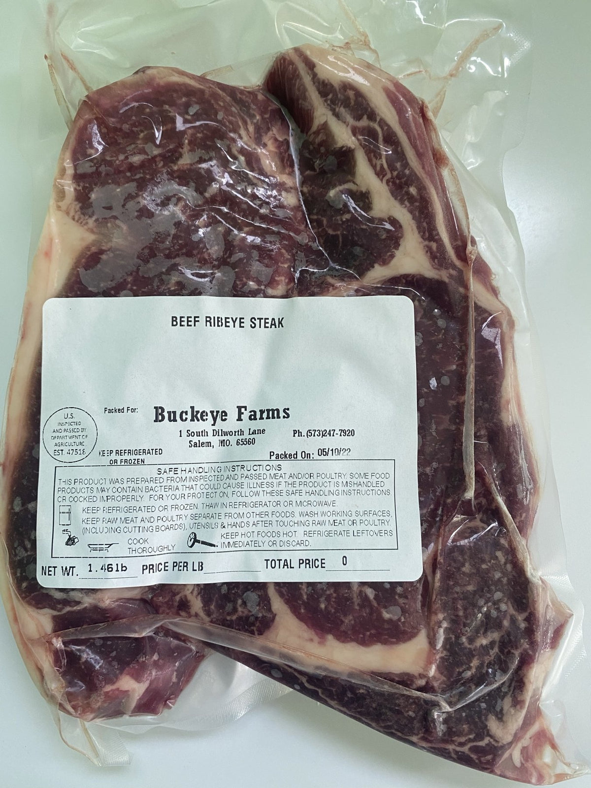 A labeled Buckeye FarmZ package of beef ribeye steak from the family farm