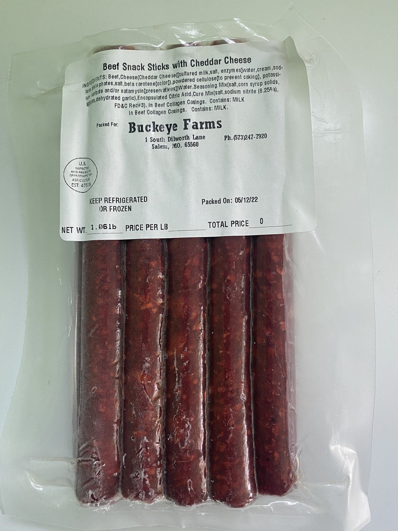 A labeled Buckeye FarmZ package of cheddar beef snack sticks
