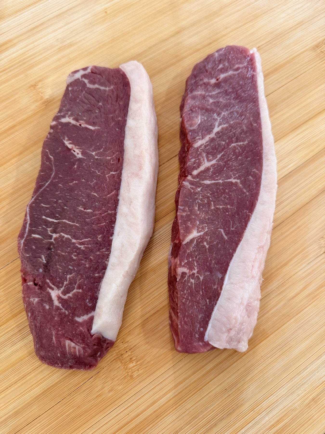 A labeled Buckeye Farms package of beef New York strip steak