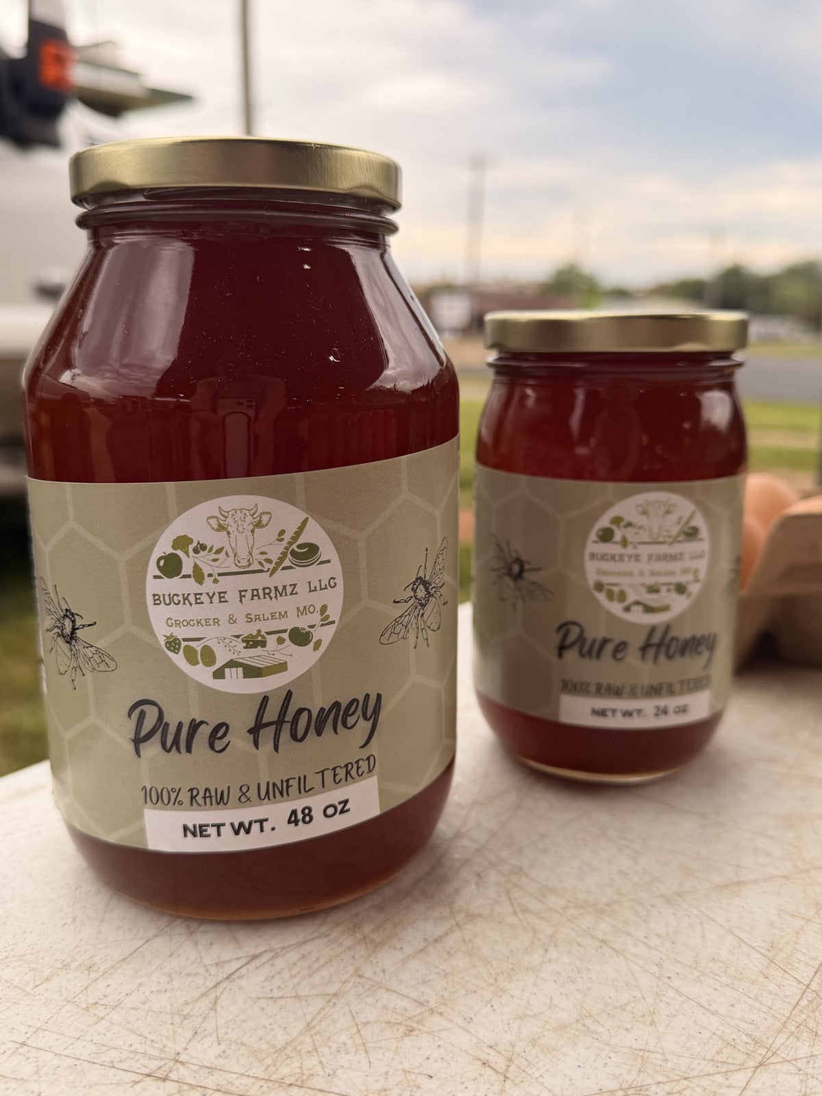 Buckeye FarmZ Pure Honey jars, 100 percent raw and unfiltered, in 48 ounce and 26 ounce sizes